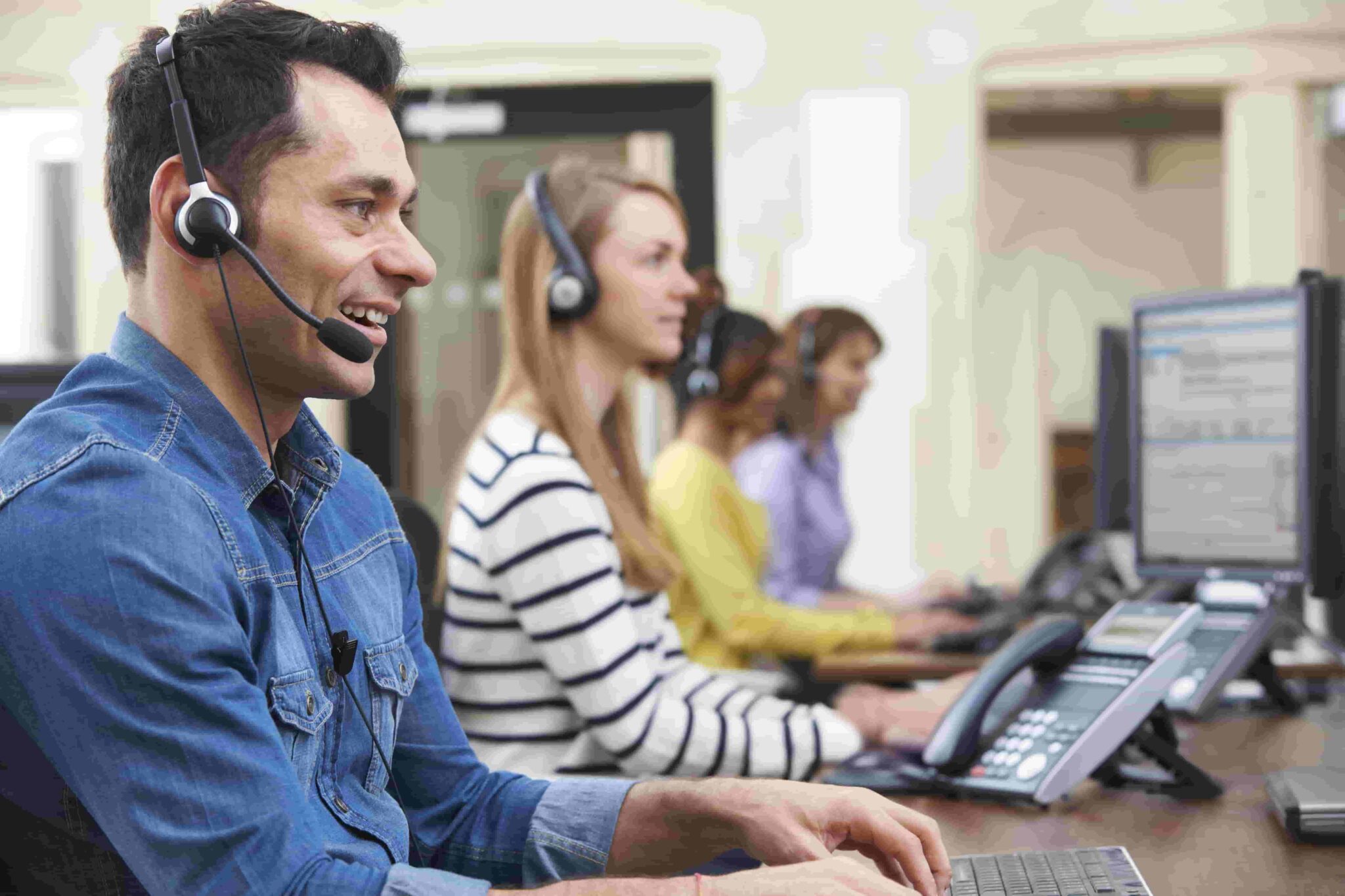 Man in blue shirt working in a call center